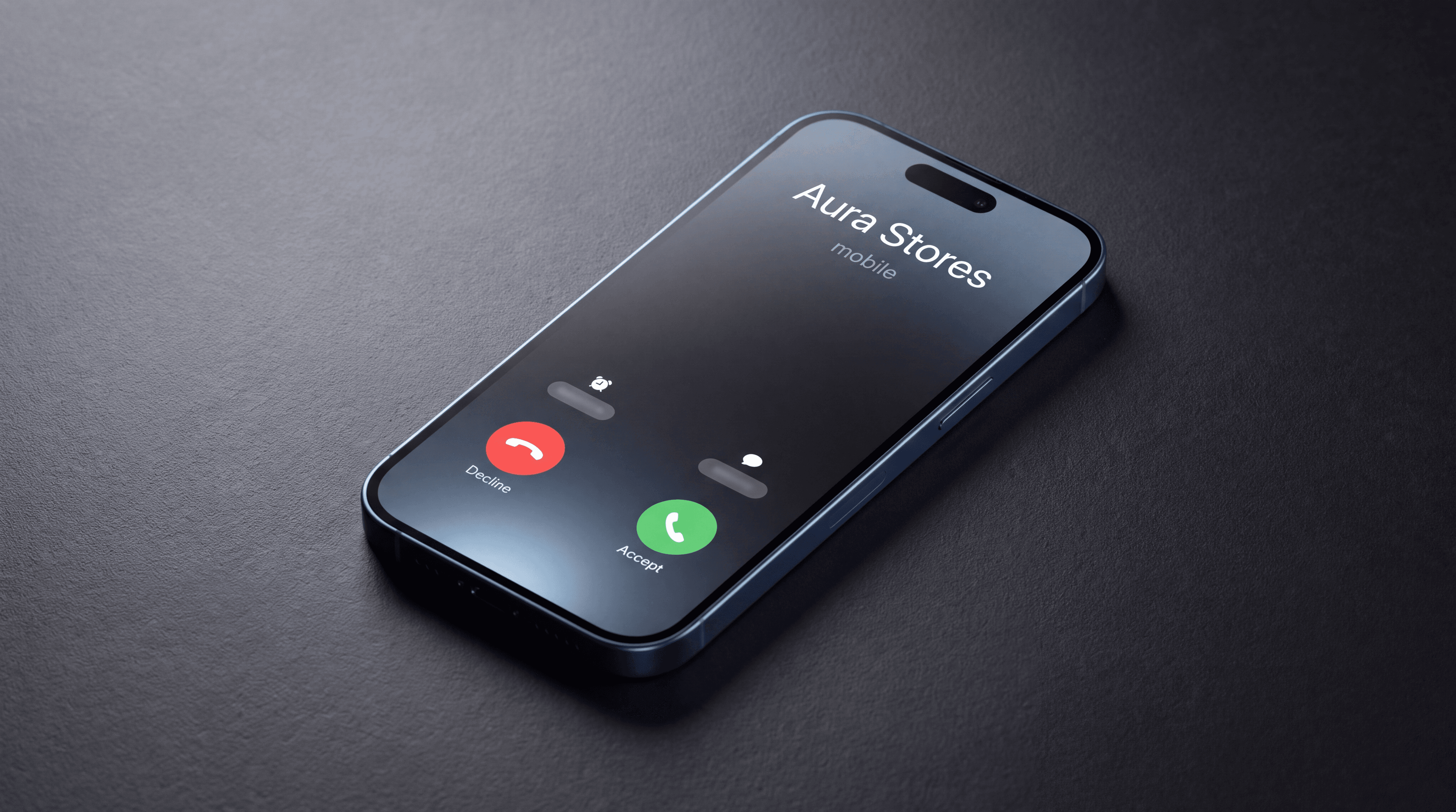 A phone lying on a desk showing an incoming call from Aura Stores, with the accept and decline buttons on screen